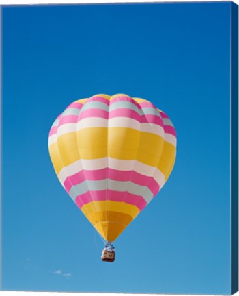 Framed Low angle view of a hot air balloon in the sky, Albuquerque, New Mexico, Yellow &amp; Pink Print