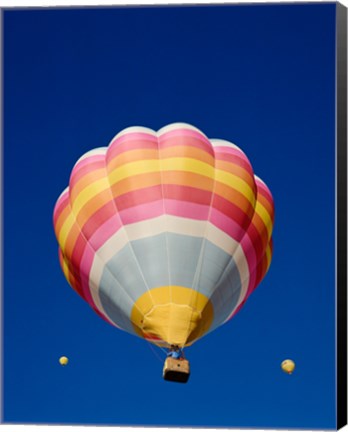 Framed Low Angle Shot of a Rainbow Hot Air Balloon Print