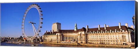 Framed Ferris wheel with buildings at the waterfront, River Thames, Millennium Wheel, London County Hall, London, England Print