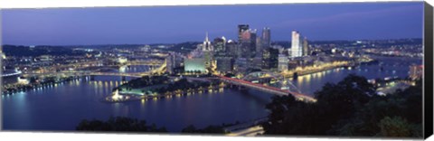 Framed Buildings along a river lit up at dusk, Monongahela River, Pittsburgh, Allegheny County, Pennsylvania, USA Print