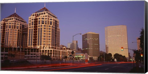 Framed USA, California, Oakland, Alameda County, New City Center, Buildings lit up at night Print