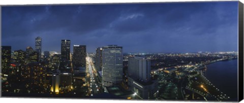 Framed High angle view of buildings in a city lit up at night, New Orleans, Louisiana, USA Print