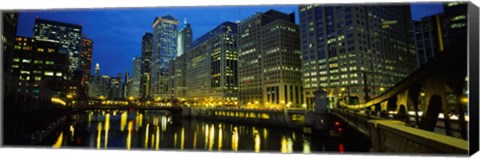 Framed Low angle view of buildings lit up at night, Chicago River, Chicago, Illinois, USA Print