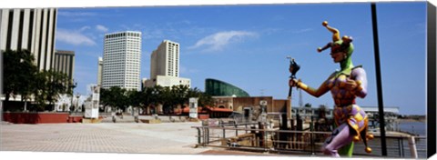 Framed Jester statue with buildings in the background, Riverwalk Area, New Orleans, Louisiana, USA Print