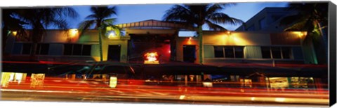 Framed Traffic in front of a building at dusk, Art Deco District, South Beach, Miami Beach, Miami-Dade County, Florida, USA Print