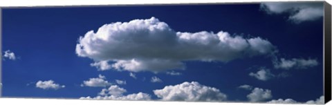 Framed Fluffy clouds in blue sky Print