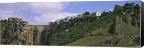 Framed Low angle view of a town, Tajo Bridge, Rio Guadalevin Gorge, Serrania De Ronda, Ronda, Andalusia, Spain Print