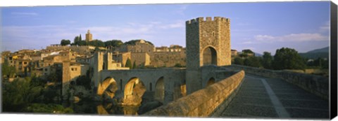 Framed Footbridge across a river in front of a city, Besalu, Catalonia, Spain Print