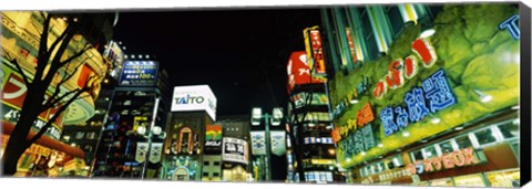 Framed Low angle view of buildings lit up at night, Shinjuku Ward, Tokyo Prefecture, Kanto Region, Japan Print