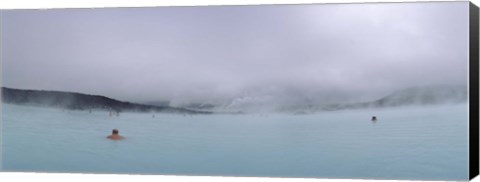 Framed Tourist swimming in a thermal pool, Blue Lagoon, Reykjanes Peninsula, Reykjavik, Iceland Print