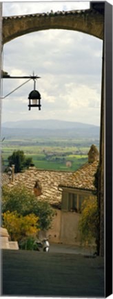 Framed Umbrian countryside viewed through an alleyway, Assisi, Perugia Province, Umbria, Italy Print