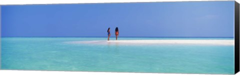 Framed Two women standing on the beach sandbar, Maayafushi Island, Ari Atoll, Maldives Print