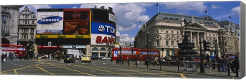 Framed Commercial signs on buildings, Piccadilly Circus, London, England Print