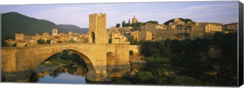 Framed Arch bridge across a river in front of a city, Besalu, Catalonia, Spain Print