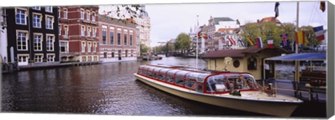 Framed Tourboat in a channel, Amsterdam, Netherlands Print