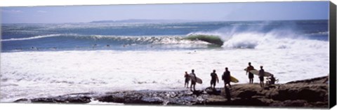 Framed Silhouette of surfers standing on the beach, Australia Print