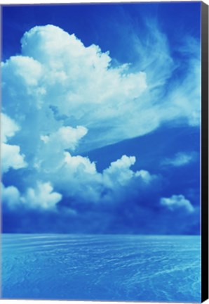 Framed White clouds in dark blue sky over rippling water Print