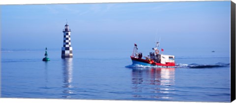 Framed Les Perdrix lighthouse and fishing boat at Loctudy, Brittany, France Print