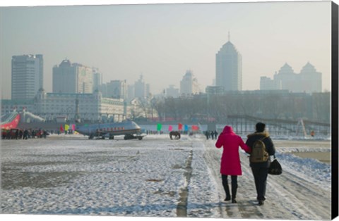 Framed Couple walking on a frozen river, Songhua River, Harbin, Heilungkiang Province, China Print