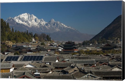 Framed High angle view of houses with Jade Dragon Snow Mountain in the background, Old Town, Lijiang, Yunnan Province, China Print