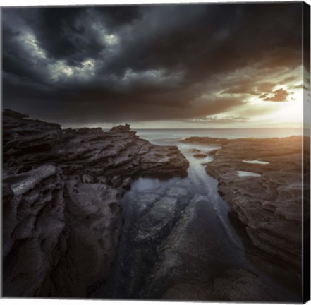 Framed Huge rocks on the shore of a sea against stormy clouds, Sardinia, Italy Print