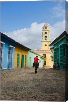 Framed Cobblestone street with cowboy on horse, Trinidad, Cuba Print