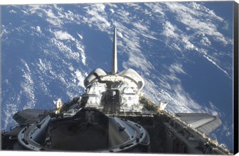 Framed partial view of Space Shuttle Atlantis Backdropped by a Blue and White Earth Print