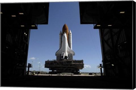 Framed Atlantis Rolls Toward the Open Doors of the Vehicle Assembly Building at Kennedy Space Center Print