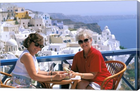 Framed Women Having Coffee on Cafe Terrace, Santorini, Greece Print