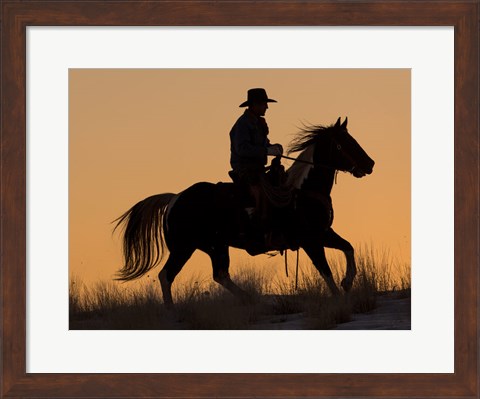 Framed Cowboy Riding His Horse Winters Snow Silhouetted At Sunset Print