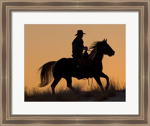 Framed Cowboy Riding His Horse Winters Snow Silhouetted At Sunset Print