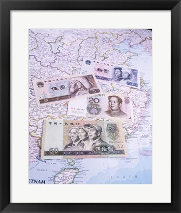 Framed Close-up of yuan notes on a map Print