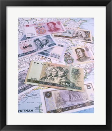 Framed Close-up of yuan notes on a map Print