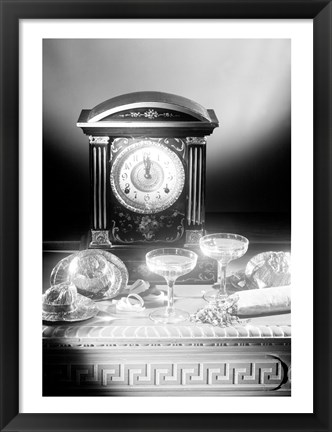 Framed Clock showing 12 o&#39;clock with champagne flutes and party hats in the foreground Print