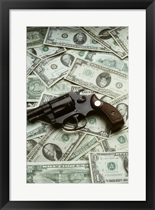 Framed Close-up of a handgun with paper currency Print