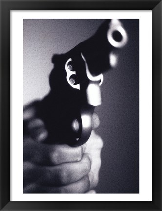 Framed Close-up of a person holding a handgun Print