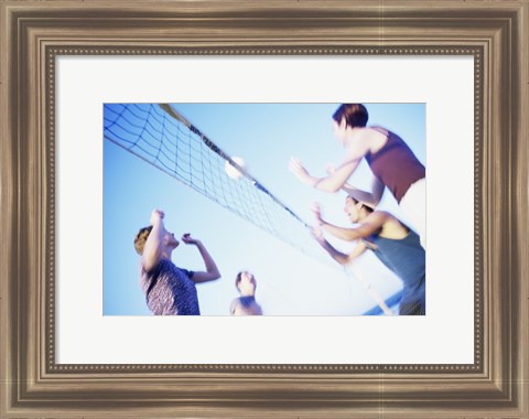 Framed Low angle view of two young couples playing beach volleyball Print