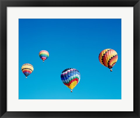 Framed 4 Rainbow Hot Air Balloons in the Bright Blue Sky Print