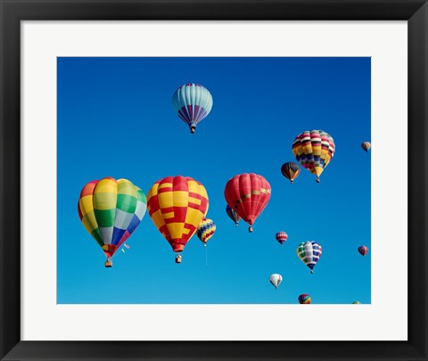 Framed Low angle view of a group of hot air balloons in the sky Print