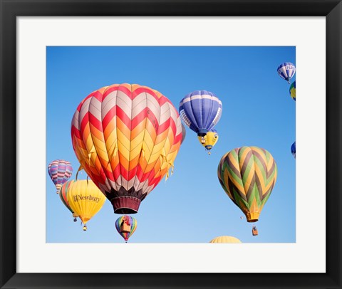 Framed Low angle view of hot air balloons in the sky Print