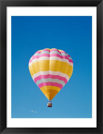 Framed Low angle view of a hot air balloon in the sky, Albuquerque, New Mexico, Yellow &amp; Pink Print