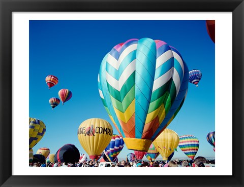 Framed Low angle view of hot air balloons taking off, Albuquerque International Balloon Fiesta, Albuquerque, New Mexico, USA Print