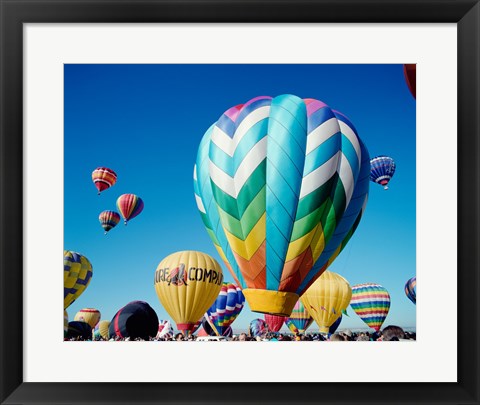 Framed Low angle view of hot air balloons taking off, Albuquerque International Balloon Fiesta, Albuquerque, New Mexico, USA Print