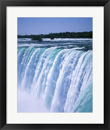 Framed Water flowing over Niagara Falls, Ontario, Canada Print