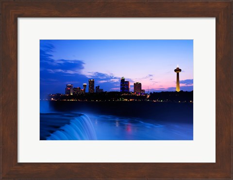 Framed Waterfall with buildings lit up at dusk, American Falls, Niagara Falls, City of Niagara Falls, New York State, USA Print