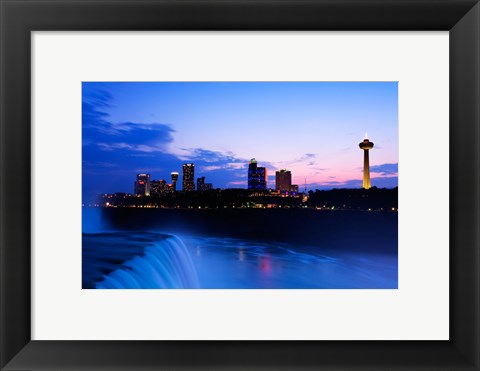 Framed Waterfall with buildings lit up at dusk, American Falls, Niagara Falls, City of Niagara Falls, New York State, USA Print