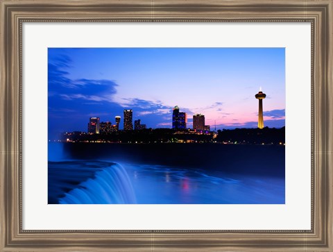 Framed Waterfall with buildings lit up at dusk, American Falls, Niagara Falls, City of Niagara Falls, New York State, USA Print