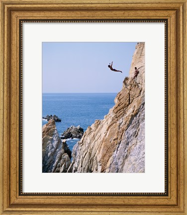 Framed Male cliff diver jumping off a cliff, La Quebrada, Acapulco, Mexico Print