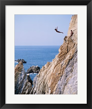 Framed Male cliff diver jumping off a cliff, La Quebrada, Acapulco, Mexico Print