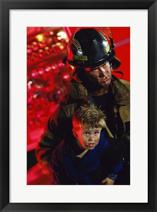 Framed Close-up of a firefighter carrying a boy Print